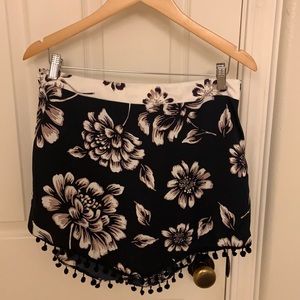 Mini skirt. Flowers with pom pom embellishments